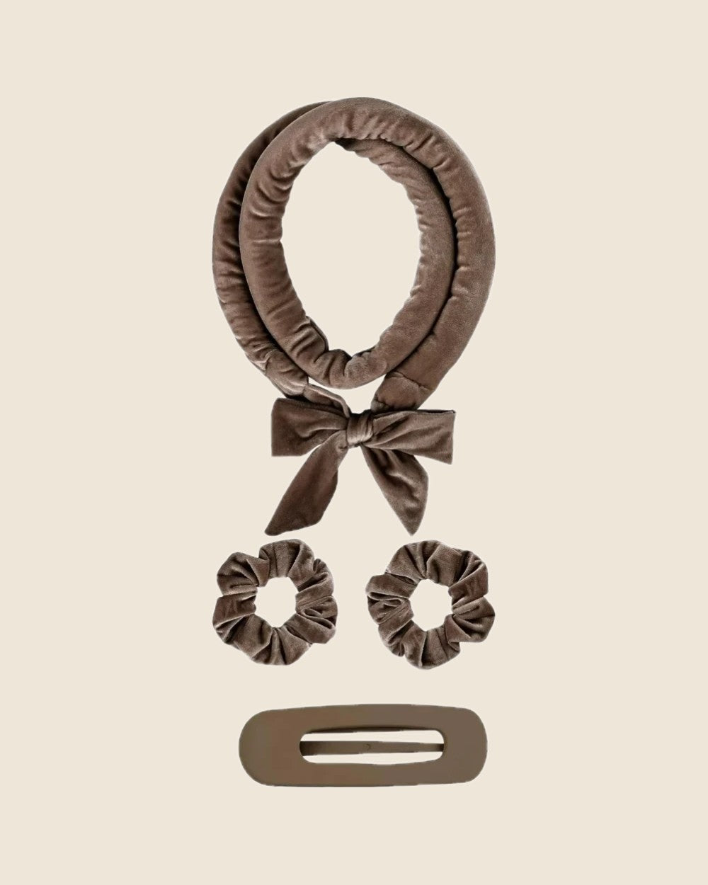 Heatless curl set on a sand background