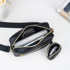 Inside the crossbody bag with a phone, plus the mini pouch