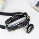 Inside the crossbody bag with a phone, plus the mini pouch