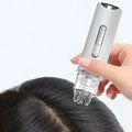 Scalp oil applicator comb applying oil at the roots
