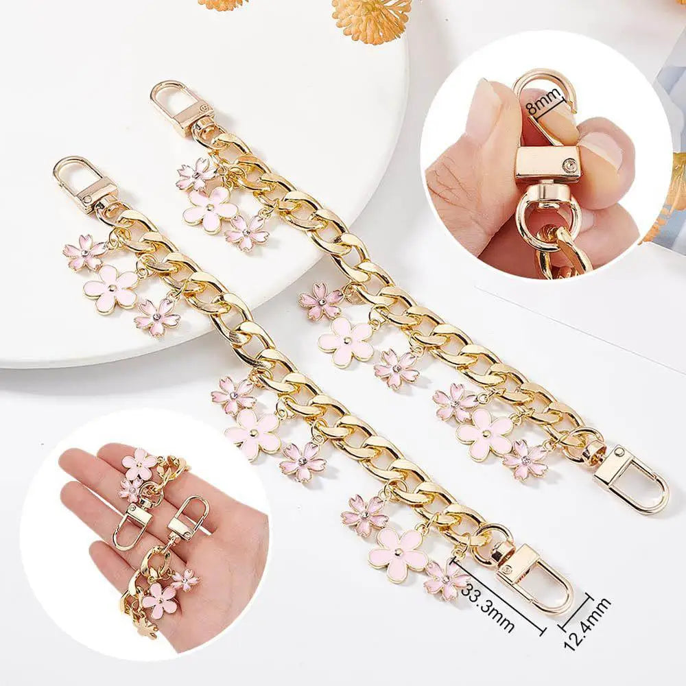 Bag charm chain shown in hand for size